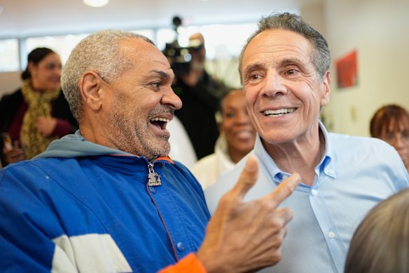 Andrew Cuomo, right, campaigns at a seniors’ centre in the Bronx. The former Democratic governor is running as an independent at this election.
