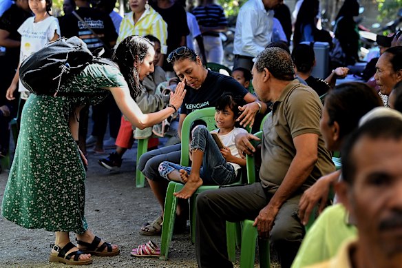University of Sydney medical oncologist Dr Telma Costa greets people at the Pakote Integradu Saude outreach event in Vila Verde village.