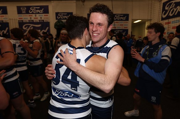 Max Holmes embraces Oisin Mullin after the Cats booked themselves another place in a preliminary final.