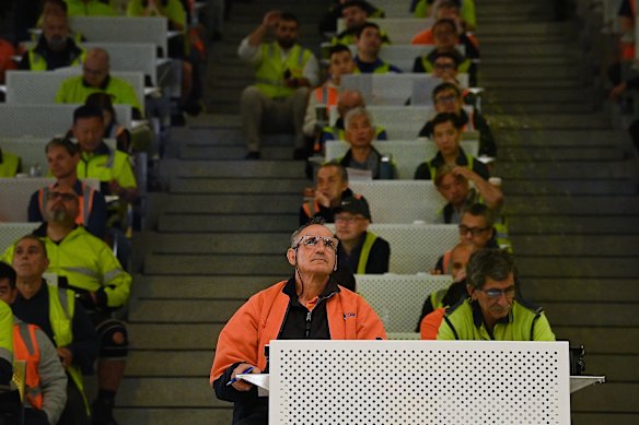 Registered buyers pack the first seafood auction on the fish market’s trading floor.