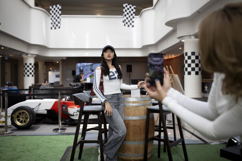 Flag finish: F1 fans in the Pullman Hotel, opposite the track in Albert Park.
