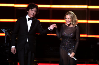 Kylie Minogue (R) with Li Yundi on stage at the Elite Model Look 28th World Final on December 6, 2011 in Shanghai.