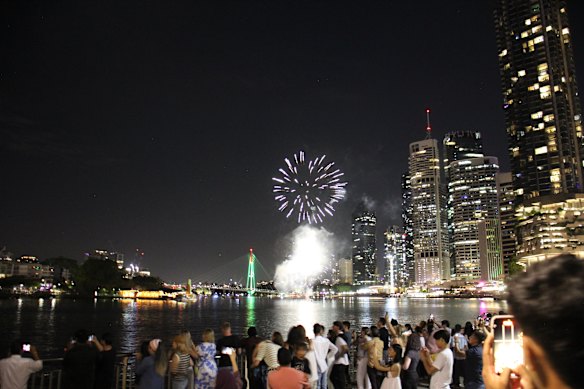 Crowds gather to watch the New Year’s Eve fireworks along the Brisbane River.