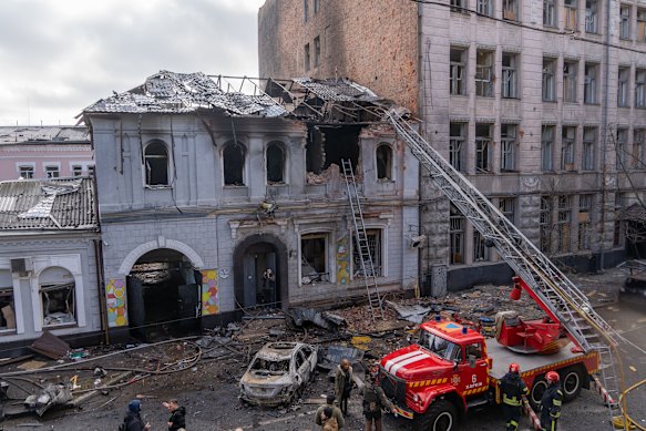 Ukraine firefighters work after a Russian drone hit a kindergarten in Kharkiv on Wednesday.
