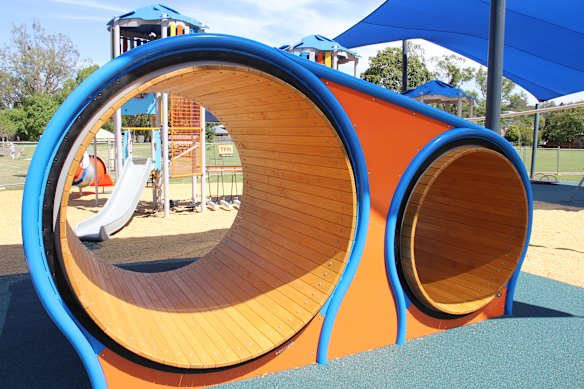 The new Fenwick Park playground includes slides, hamster wheels, a flying fox, swings, a bridge and a climbing wall. 