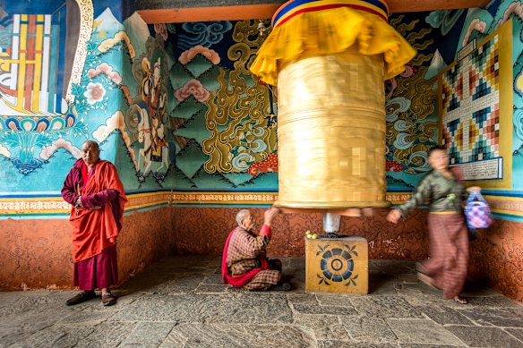 Prayer wheel turning at Punakha Monastery Bhutan.