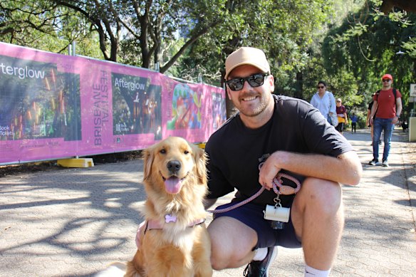 Harrison with his golden retriever Marley at the City Botanic Gardens on Wednesday. 