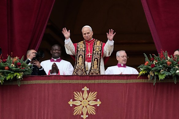Pope Leo XIV waves after delivering the Urbi et Orbi (‘to the city and to the world’ ) Christmas’ day blessing from the main balcony of St Peter’s Basilica at the Vatican.