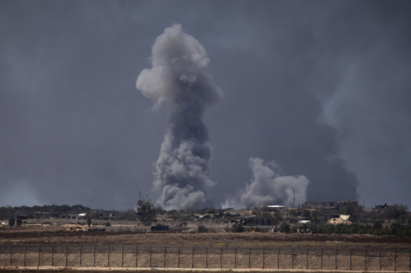 Smoke emergence  implicit    the confederate  portion  of the Gaza Strip aft  an Israeli bombardment.