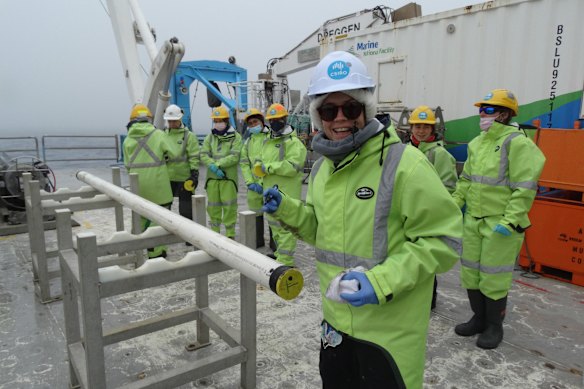 Dr Linda Armbrecht from the Australian COOKIES mission with a cylindrical sediment core sample from the Cook Glacier in January-February 2026.