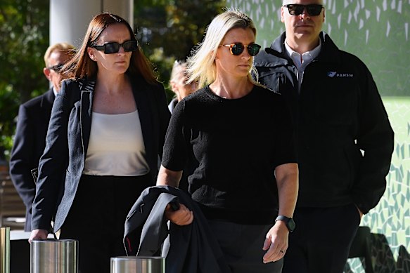 NSW Police Inspector Amy Scott (centre) arriving at the NSW Coroner’s Court in Lidcombe a year after the attack.