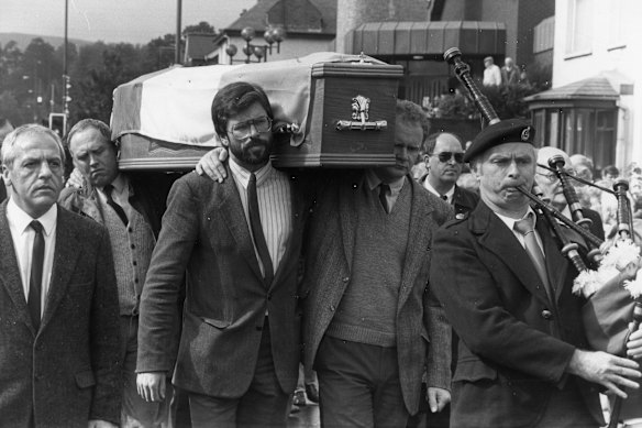 Adams, who denies being an IRA member, helps carry the coffin of IRA man Seamus Twomey in September 1989.