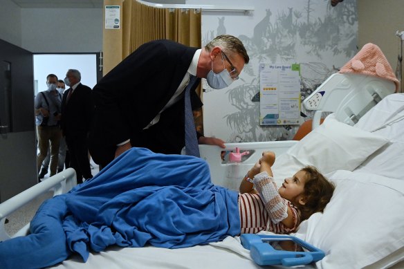 Dominic Perrottet talks to three-year-old Gabriella Ferreira in Campbelltown Hospital.