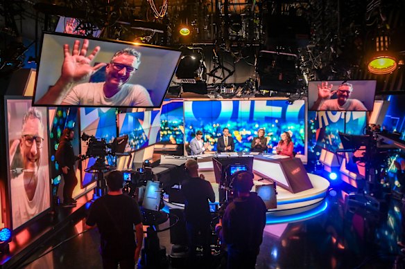Comedian Adam Hills (on screen) bids farewell to The Project.