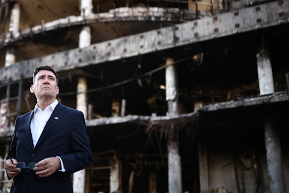 Burnham is shown the rubble at the site of a strike near the Lukanivska market in Kyiv.