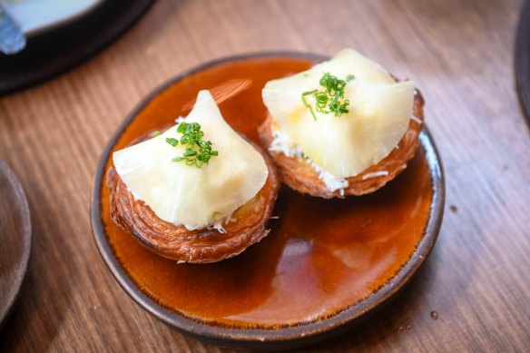 Celeraic Portuguese tarts topped with spanner crab.