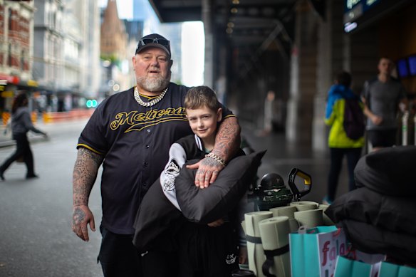 Father and son handed out hundreds of dollars in items including toiletries, clothing and chargers. 