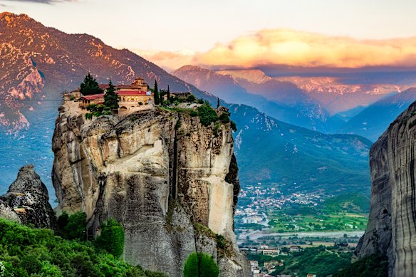 The Monastery of the Holy Trinity perched atop a sandstone rock formation in Meteora.