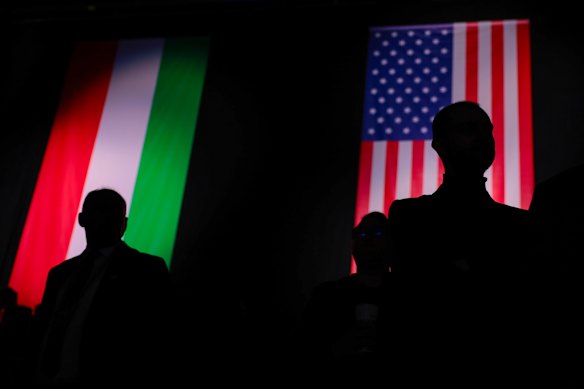 People stand silhouetted against a backdrop of the U.S. and Hungarian flags, on the day of the Day of Friendship event attended by Hungarian Prime Minister Viktor Orban and U.S. Vice President JD Vance, at MTK Sportpark on April 7, 2026 in Budapest, Hungary. Vance is supporting Orban’s bid for reelection in Hungarian parliamentary elections scheduled for April 12. 
