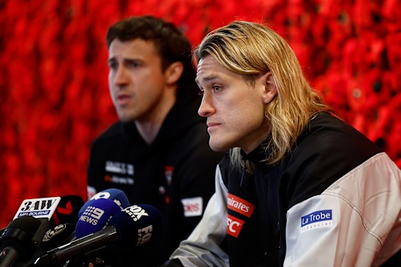 Pies skipper Darcy Moore and his Essendon counterpart Andrew McGrath at the Shrine on Monday.