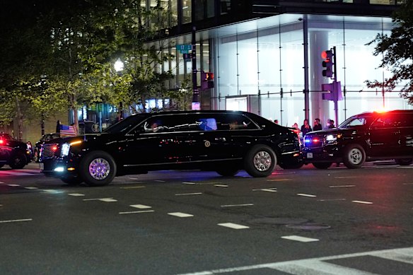 The president’s motorcade departing the hotel after the shooting.