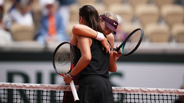 Mirra Andreeva hugs with Daria Kasatkina after thier fourth round match.