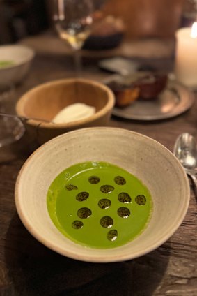 Watercress and arugula veloute, hay-infused whipped cream, truffle oil and a side of truffle brioche at Septime, Paris.