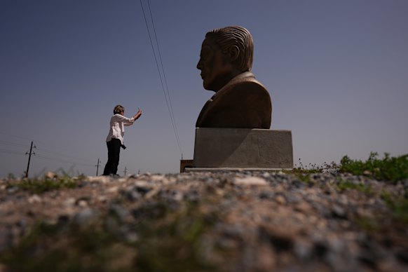 A large bust of Musk near the SpaceX hub.