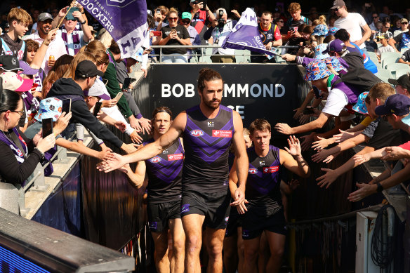Alex Pearce of the Dockers leads his team out.