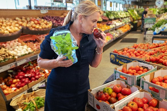 Donna Hay stops to smell the tomatoes at Harris Farm in Rose Bay.