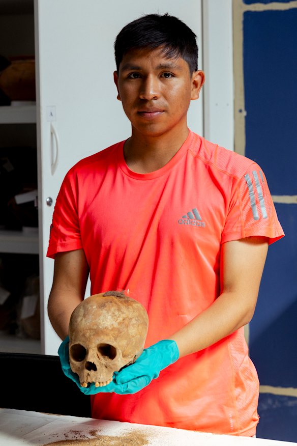 Local archaeologist Julio Asencio with one of the skulls.