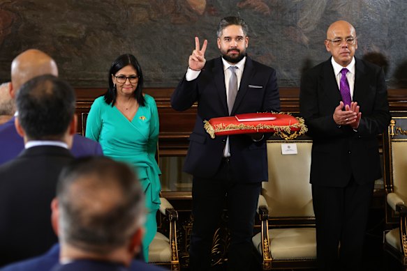 Venezuelan Vice President Delcy Rodr&iacute;guez (left) with Nicol&aacute;s Maduro Guerra and Jorge Rodr&iacute;guez after being sworn in as acting president.