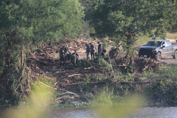 Authorities search along the Guadalupe River following catastrophic flooding in Kerrville, Texas.