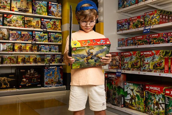 Six-year-old Leo Fenton-Wells looking at the Ninjago Lego range at the Lego Store in Pitt Street Mall.