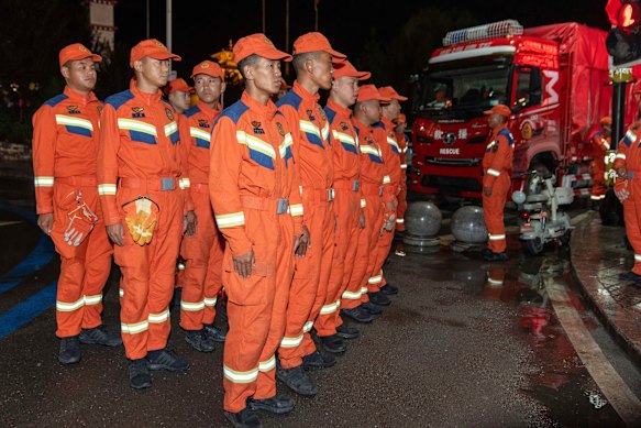 Chinese rescuers prepare before heading to the mudslide-stricken area near Gyirong Port, Tibet.