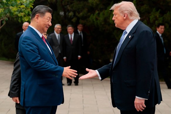 US president Donald Trump shakes hands with his Chinese counterpart Xi Jinping while leaving after a visit to the Zhongnanhai Garden in Beijing.