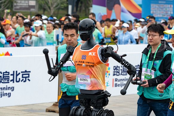 To demonstrate advances in automation, Beijing held a half-marathon for 12,000 runners and 20 humanoid robots. Only six robots finished. 