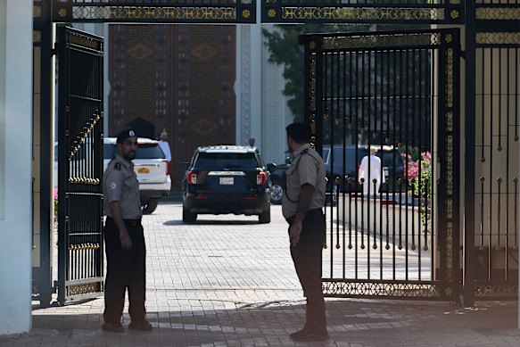 Omani security personnel watch a convoy believed to be carrying US envoy Steve Witkoff in Muscat, Oman, on Saturday.