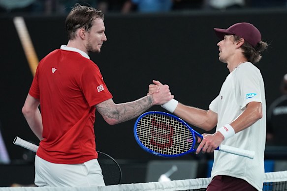 Alex de Minaur, right, of Australia is congratulated by Alexander Bublik, left, of Kazakhstan in following fourth round match.