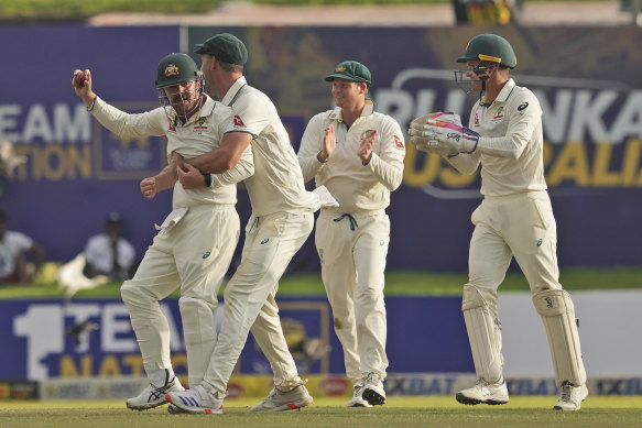 Australia’s Travis Head celebrates after taking a catch to dismiss Sri Lanka’s Angelo Mathews during day two.