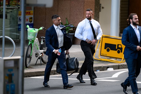 Run Nation Championship co-founder and chief executive Tremaine Fernandez and former NRL player Sandor Earl arrive at the NSW Supreme Court in Sydney on Tuesday.