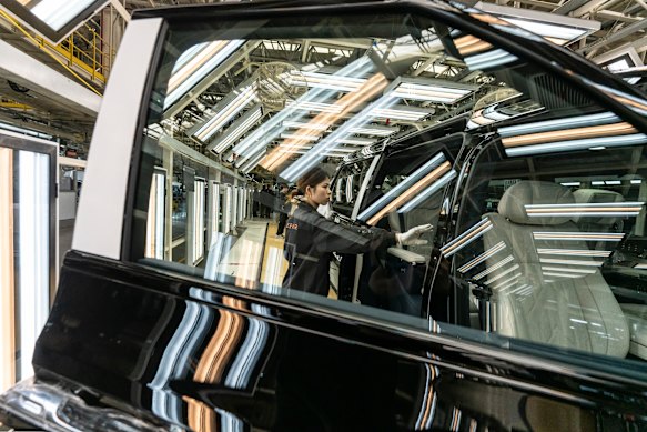 A white-glove inspection of a vehicle on the assembly line. There remain some tasks that computers and cameras can’t do on their own. 
