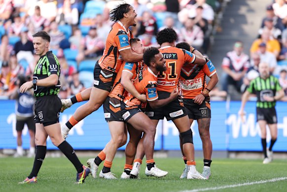 The Tigers celebrate a try from Samuela Fainu.