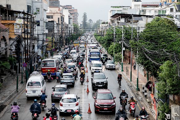 Buses, motorbikes, small trucks and taxis fill the streets of Kathmandu with horns and exhaust fumes. 