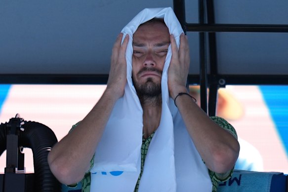 Daniil Medvedev takes a moment in the shade during his third-round match.