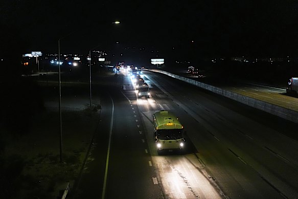 A convoy of buses moves after leaving the Marine Corps base in Twentynine Palms, California on Monday.