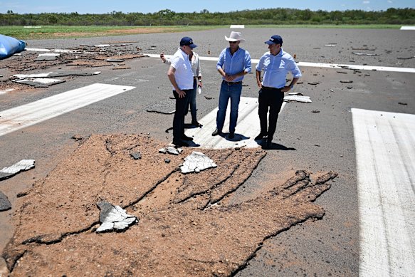 Prime Minister Anthony Albanese, Cloncurry Mayor Greg Campbell and Federal Treasurer Jim Chalmers at a damaged Cloncurry Airport.