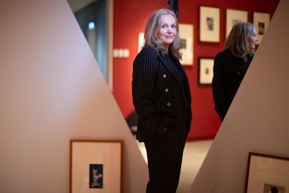 Lesley Harding among images by Man Ray and Dupain.