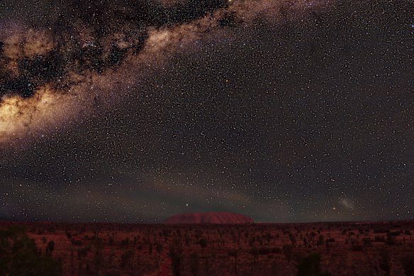 The star field stretches to the horizon at Uluru.