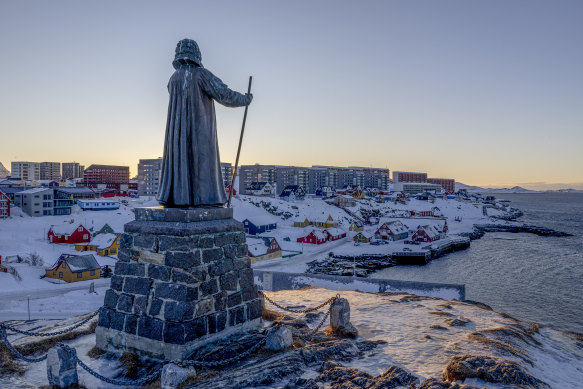 A statue commemorating Hans Egede, the Danish missionary who founded Nuuk in 1728, stands on a hill overlooking the town in Greenland.